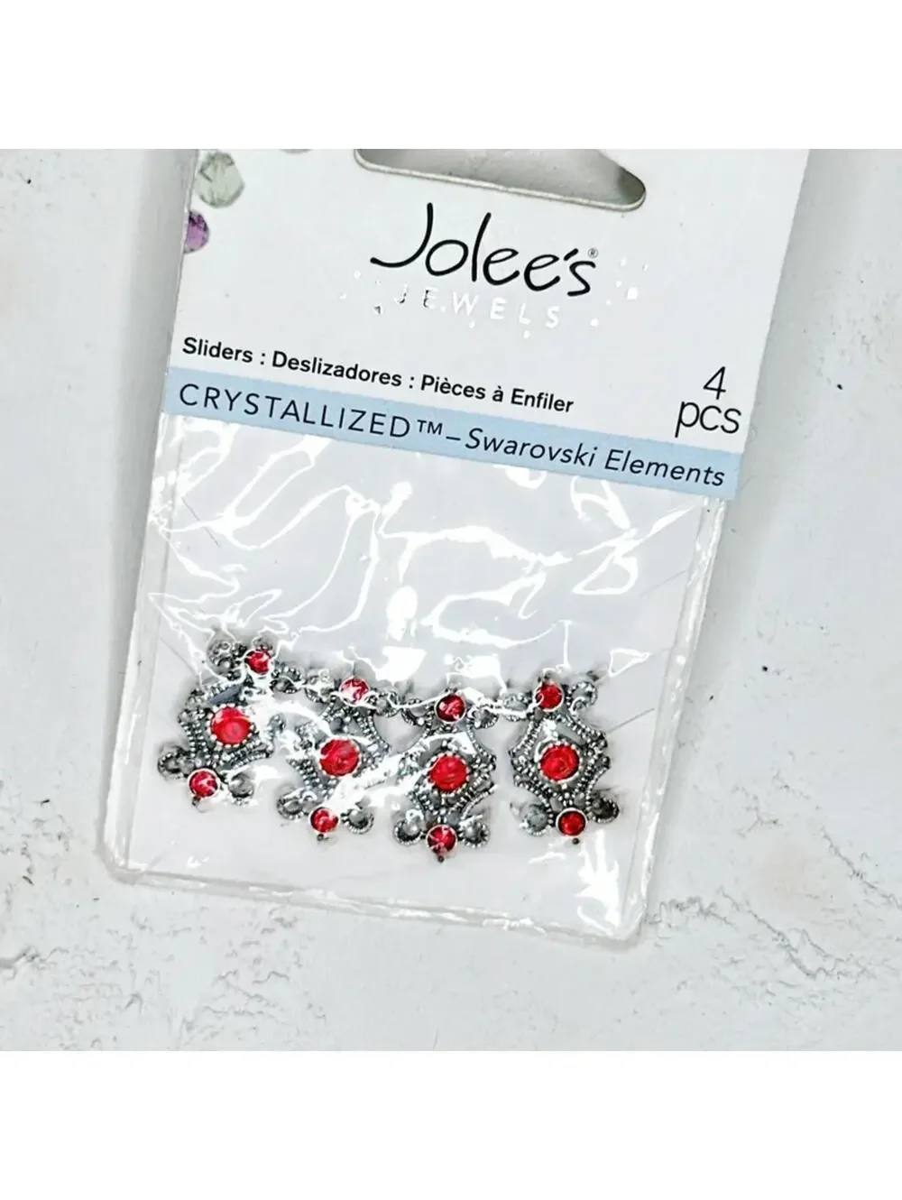 5091u. Jolee’s Red and Silvertone Slider Beads